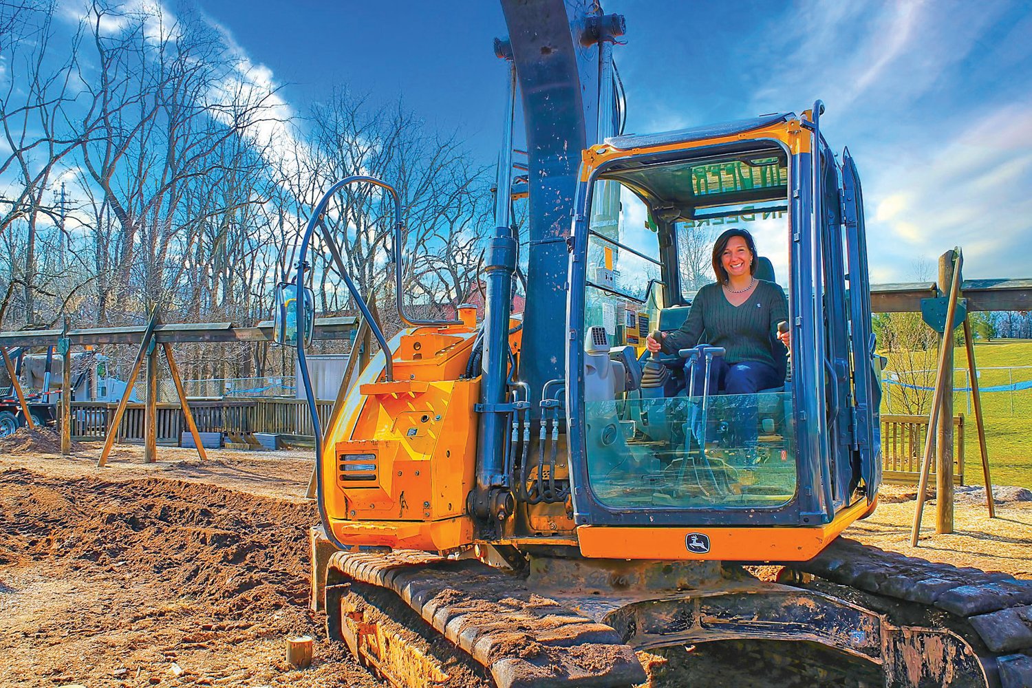 Dawn Byers posed in a bulldozer in 2013, as renovations at Kids Castle in Doylestown Township’s Central Park got underway.