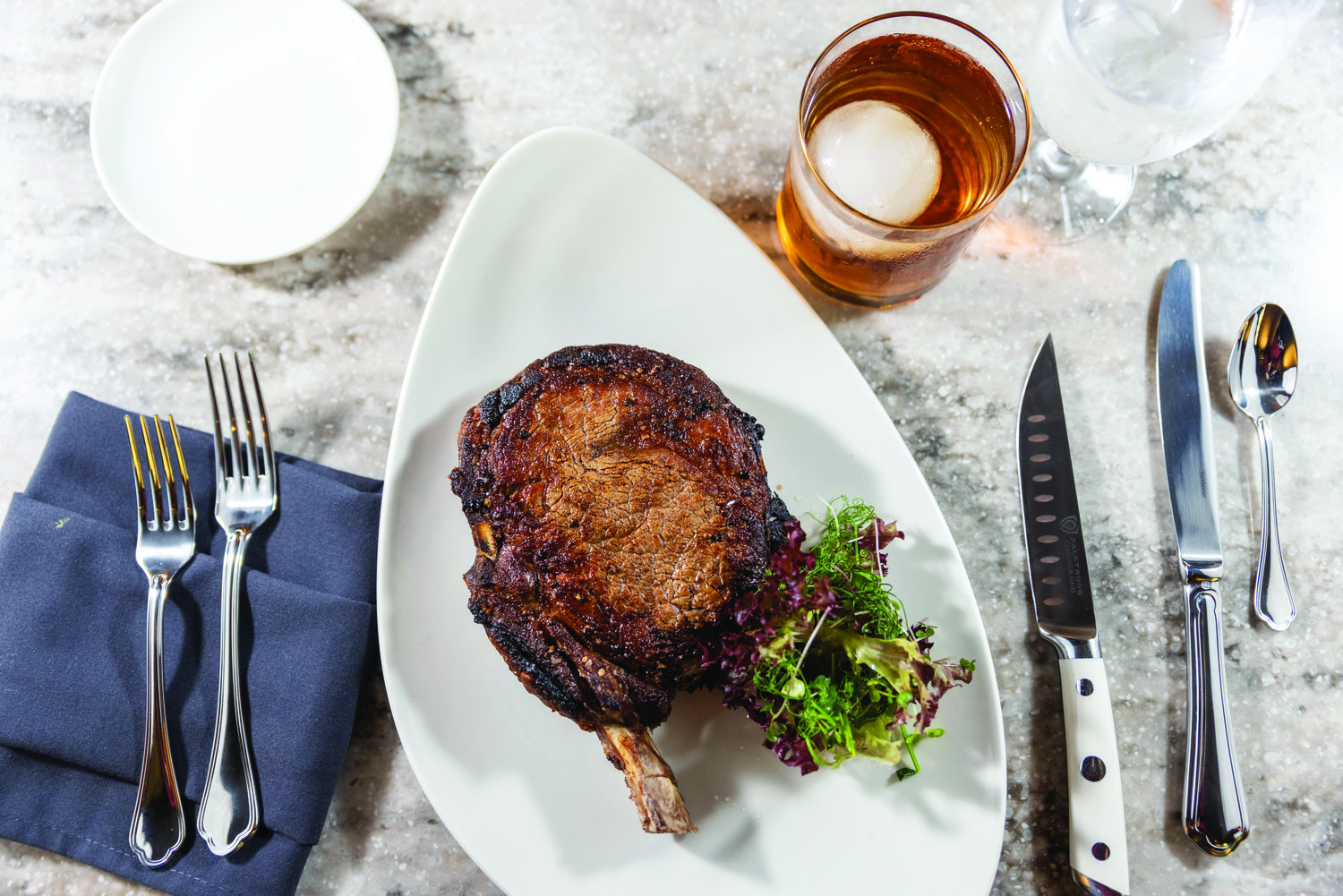 A 24-ounce dry-aged cowboy ribeye is prominent among the steak choices at Oldestone.