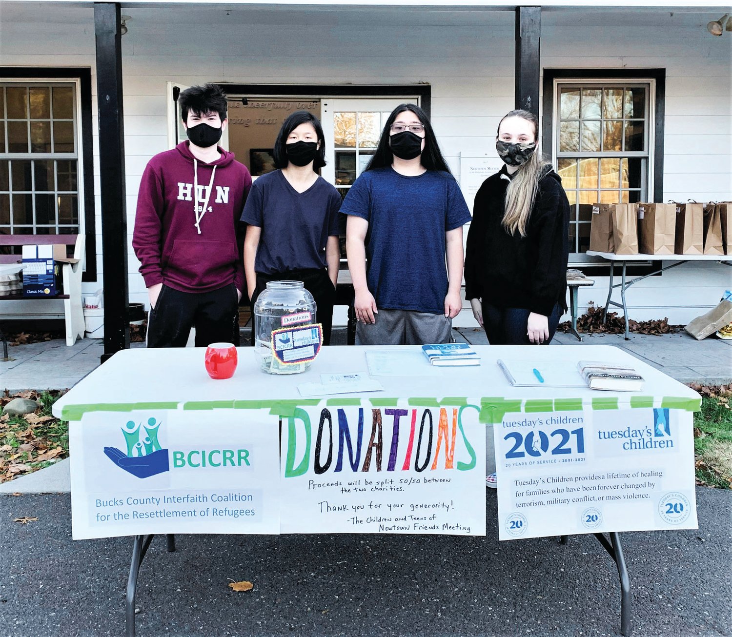 The youth of Newtown Friends Meeting accept donations for two charities during this year’s Virtual Simple Supper, which offered take-out soups and desserts.