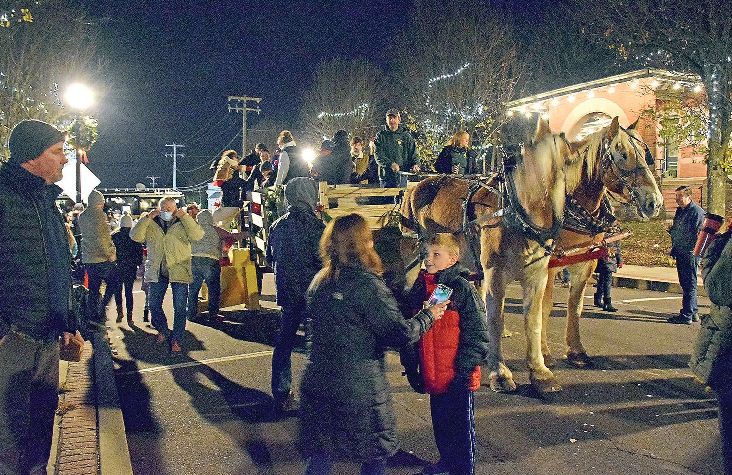 Community members take a horse-drawn carriage ride.