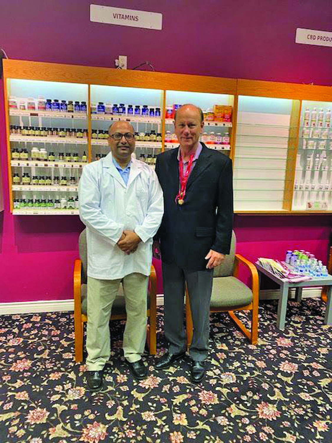 Pharmacist Nitin Aggarwal with New Hope Mayor Larry Keller.
