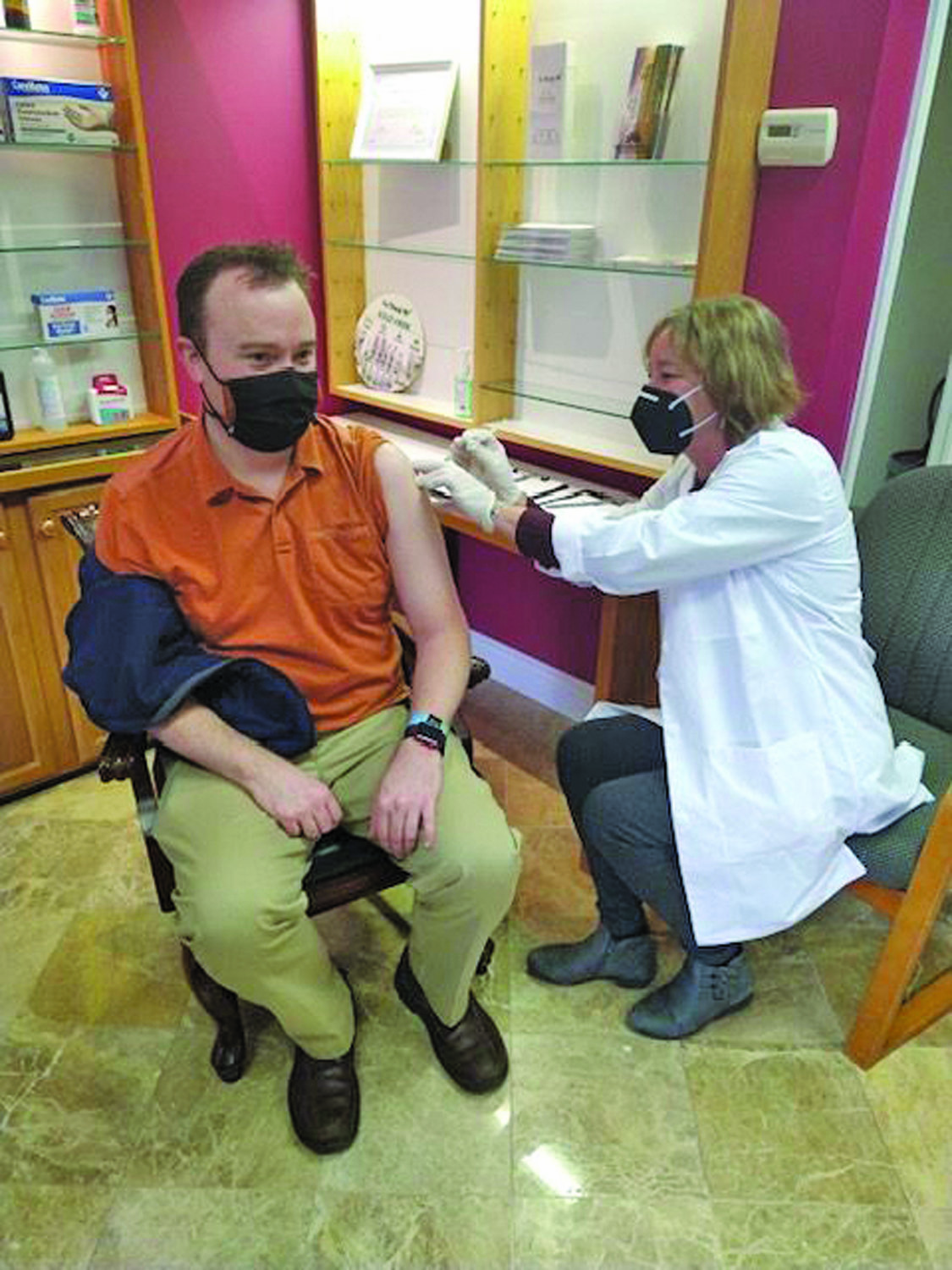 A New Hope Pharmacy and Wellness customer receives a vaccination.