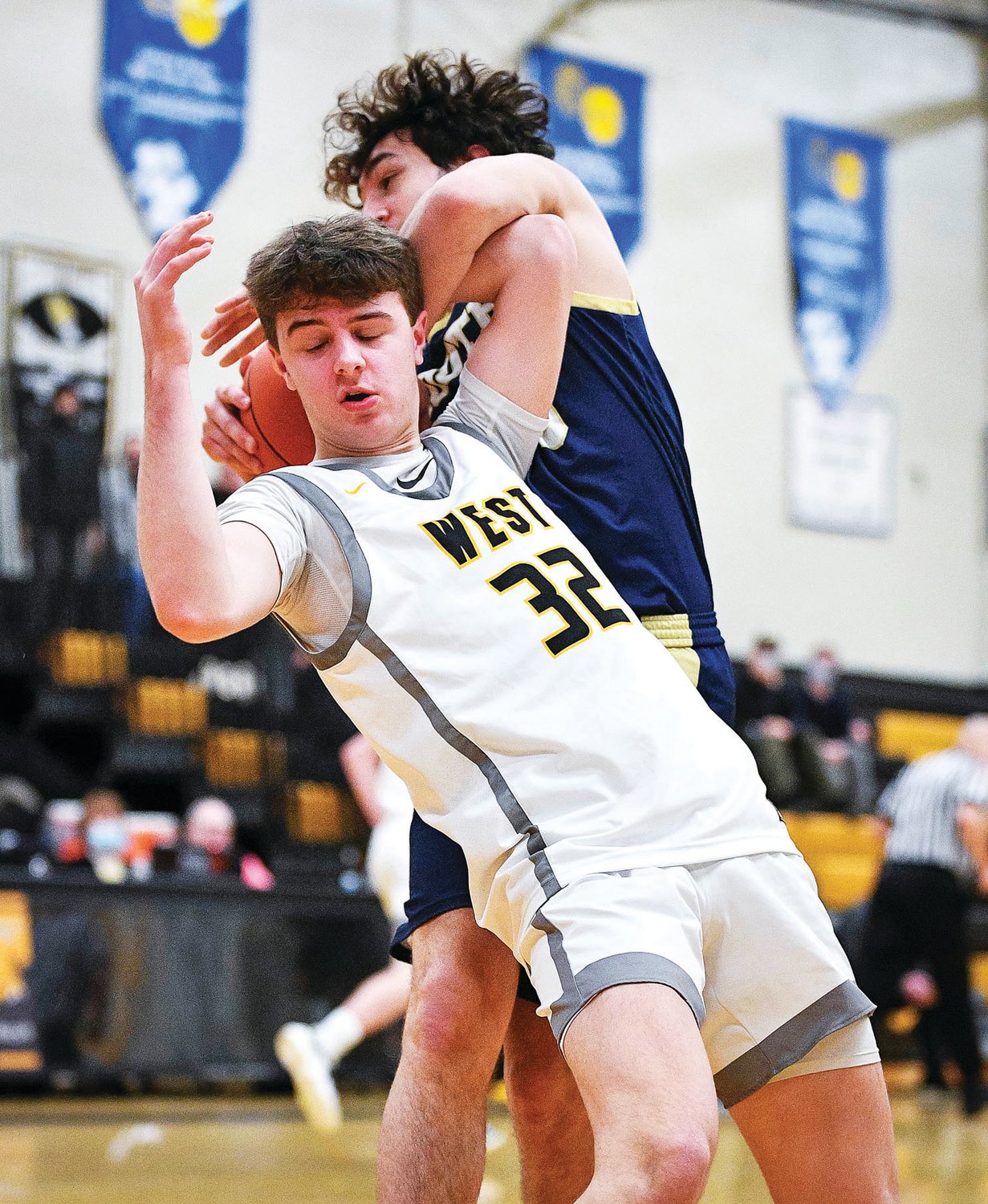 CB West’s Bowen Gugger gets hacked for a foul by CR South’s Chase Littig.