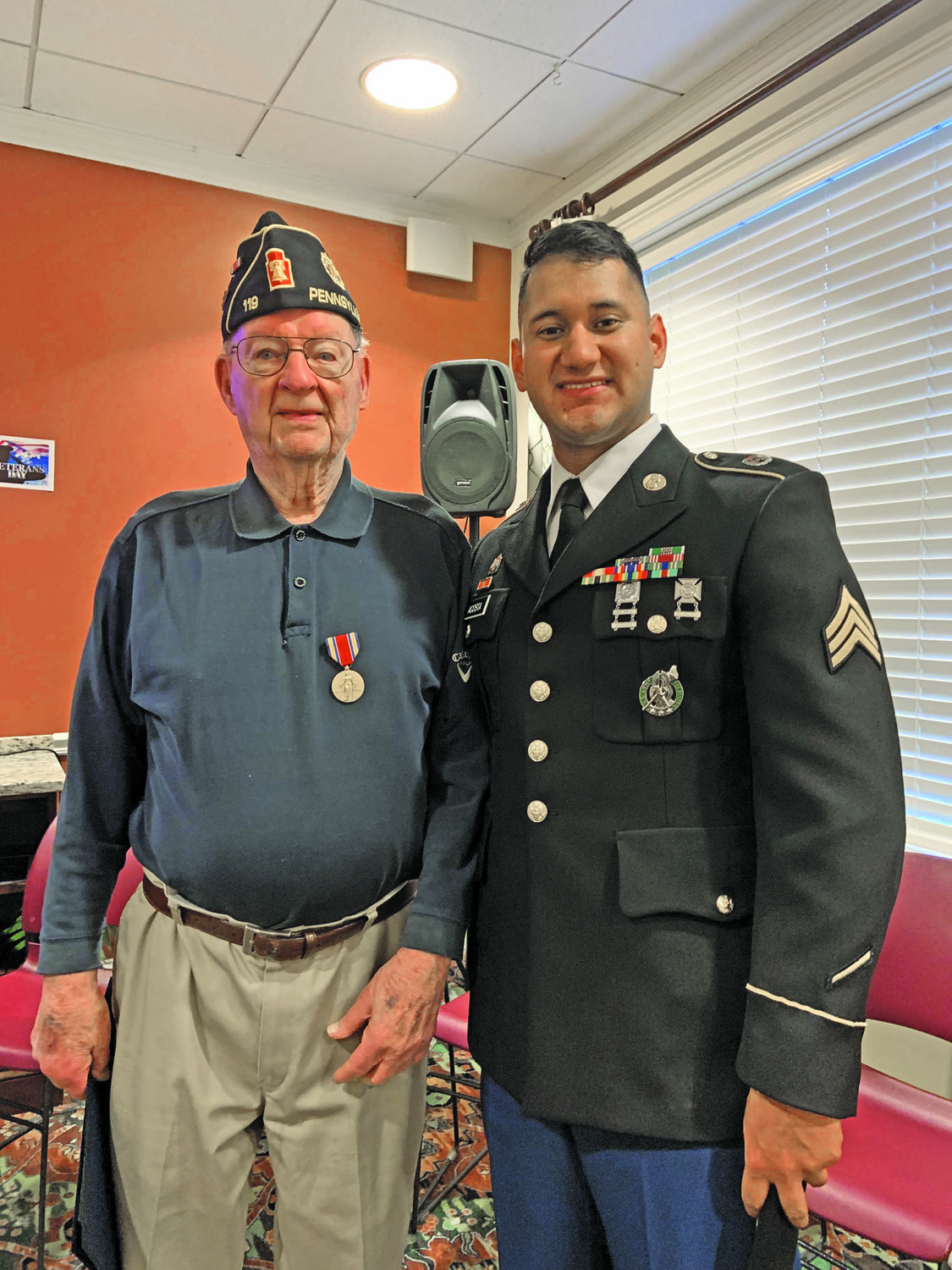 WWII veteran and resident of The Manor at York Town Art Wimmell and U.S. Army Sgt. Allen Acosta.