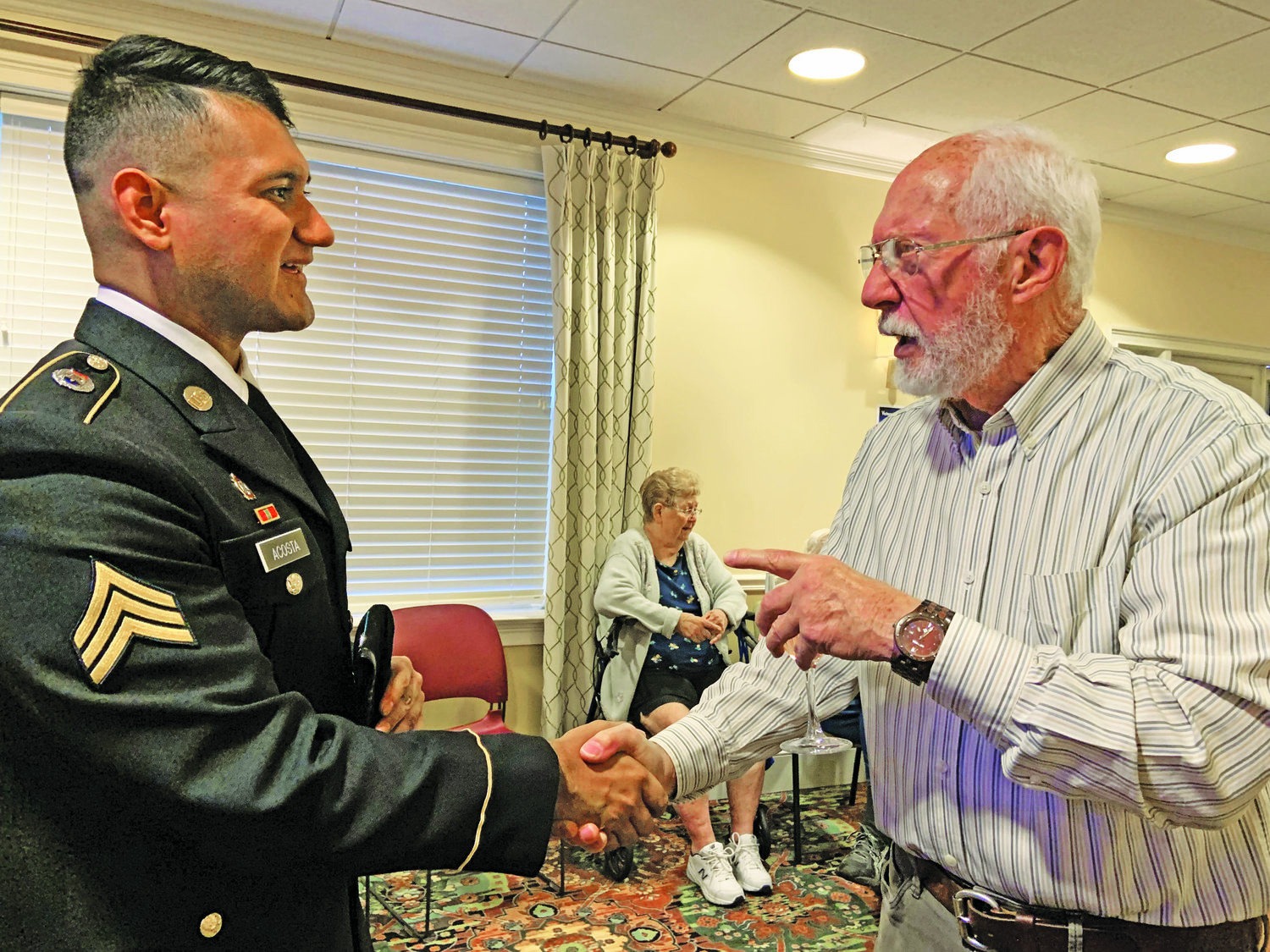 Resident of The Manor at York Town Hank DiPasquale and U.S. Army Sgt. Allen Acosta.