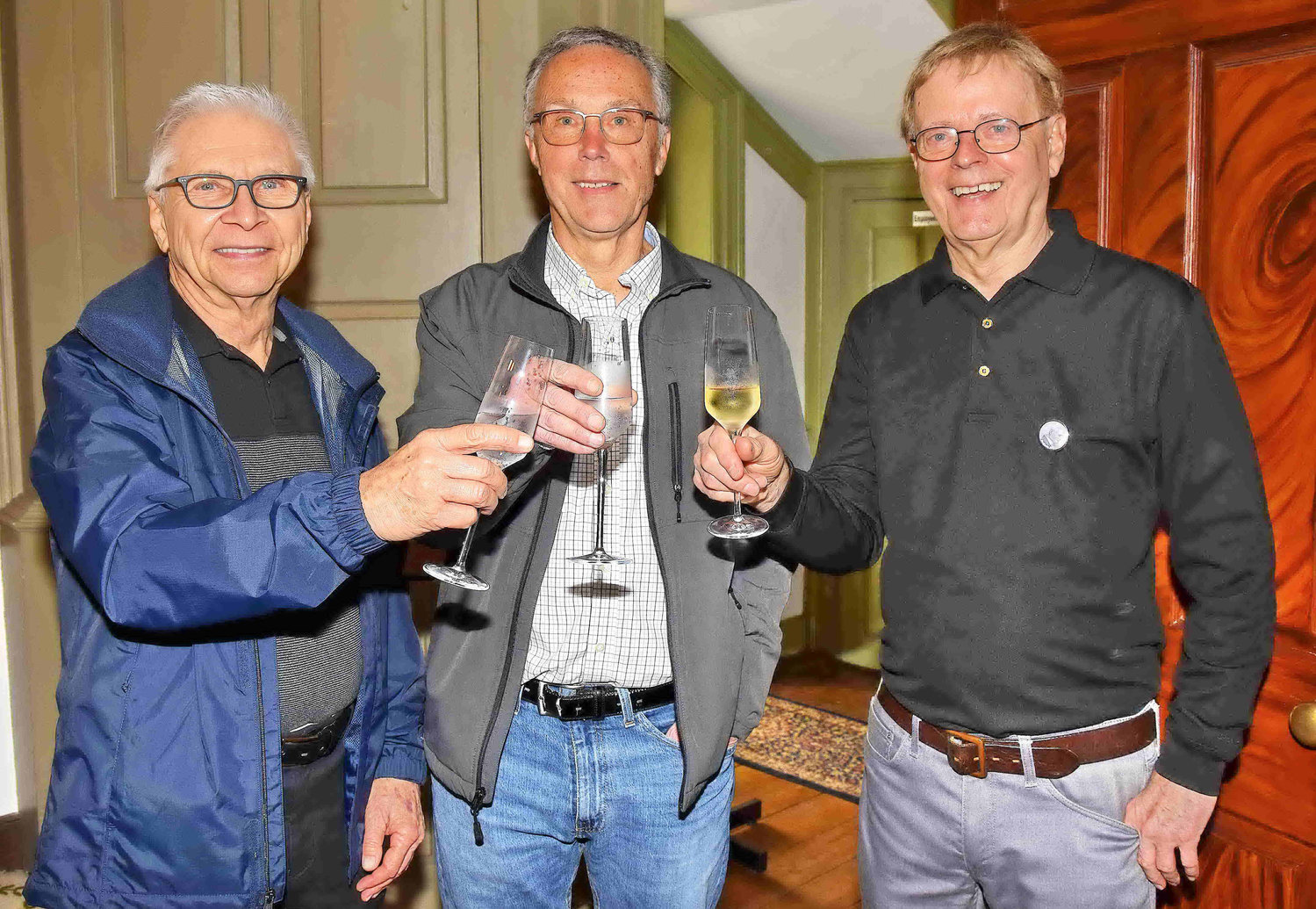 Chuck Tarr, Tom Williams and Roy Ziegler toast Benjamin Parry.