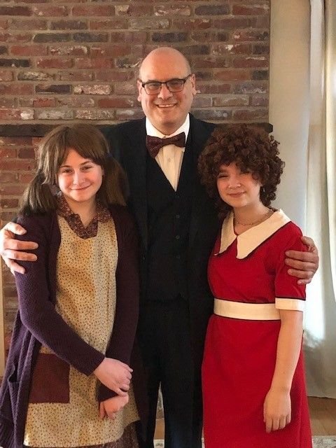 Lydia O’Halloran of Willow Grove, left, and Courtney Neiman of Levittown, right, will share the role of Annie, with Mark Scher of Holland as Oliver “Daddy” Warbucks in Neshaminy Valley Music Theatre’s upcoming production of “Annie.”