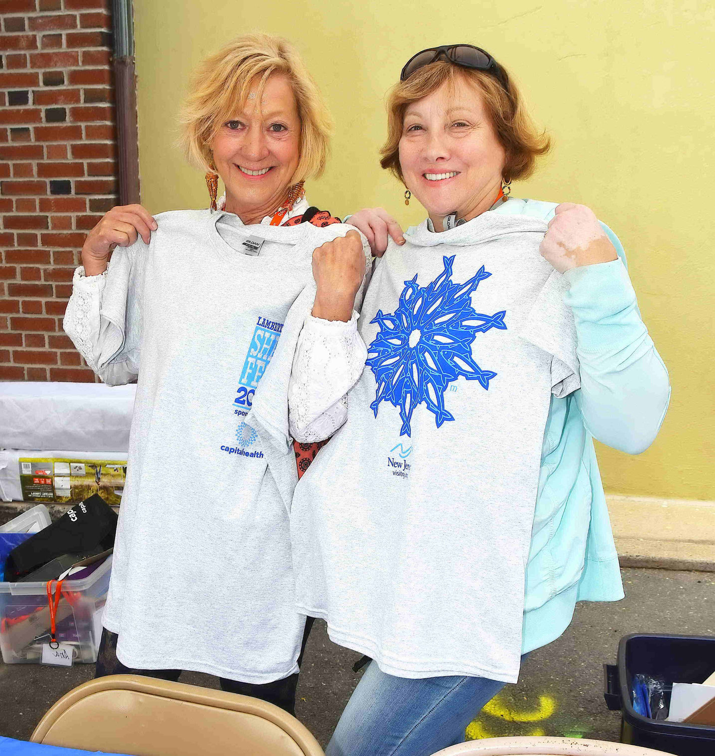 Mary Palco and Nora Lunderman with the Shad Fest official T-shirts.