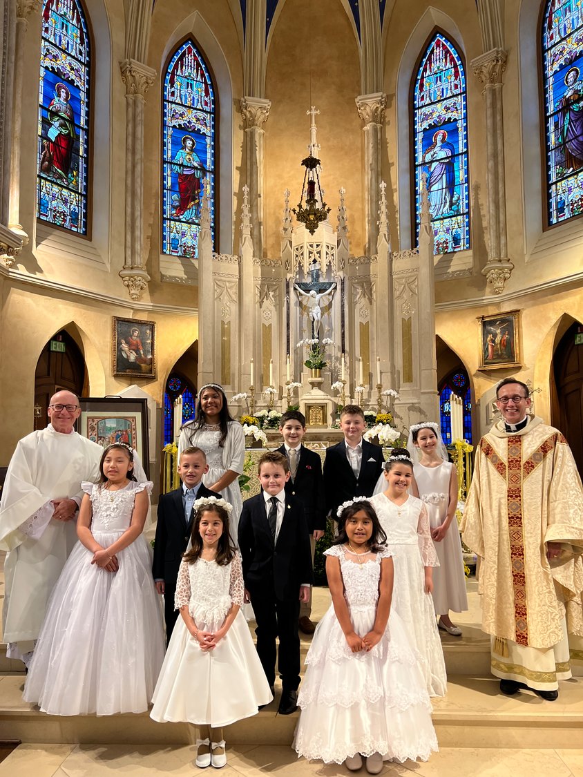 From left are: front row, Sophia Sorial, Daisy Vilchis Veyta, second row, Deacon Kevin Morrison, Paloma Marraquin Garcia, Holden Morris, Cullen Tilch, Ava Salinas and Kolakowski, third row, Bella Del Cueto, Truman Sternberg, Cooper Feinthel and Christine de Marcellus.