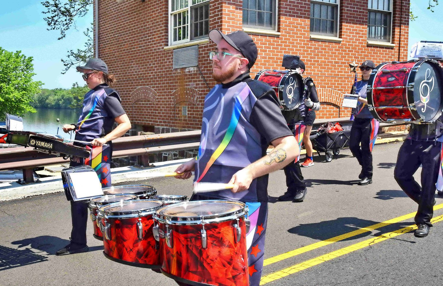 Members of DC’s Different Drummers from Washington, D.C., play as they march.