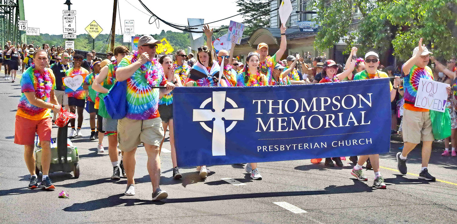 Parade goers representing Thompson Memorial Presbyterian Church march through New Hope.