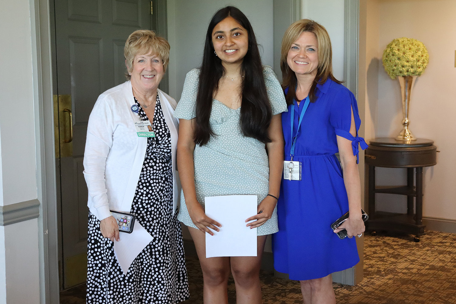 Ananya Siragavarapu, 2022 Teen Volunteer Scholarship award winner, center, with Karen Langley, director of volunteer services, left, and Lynette Stricker, volunteer coordinator, right.
