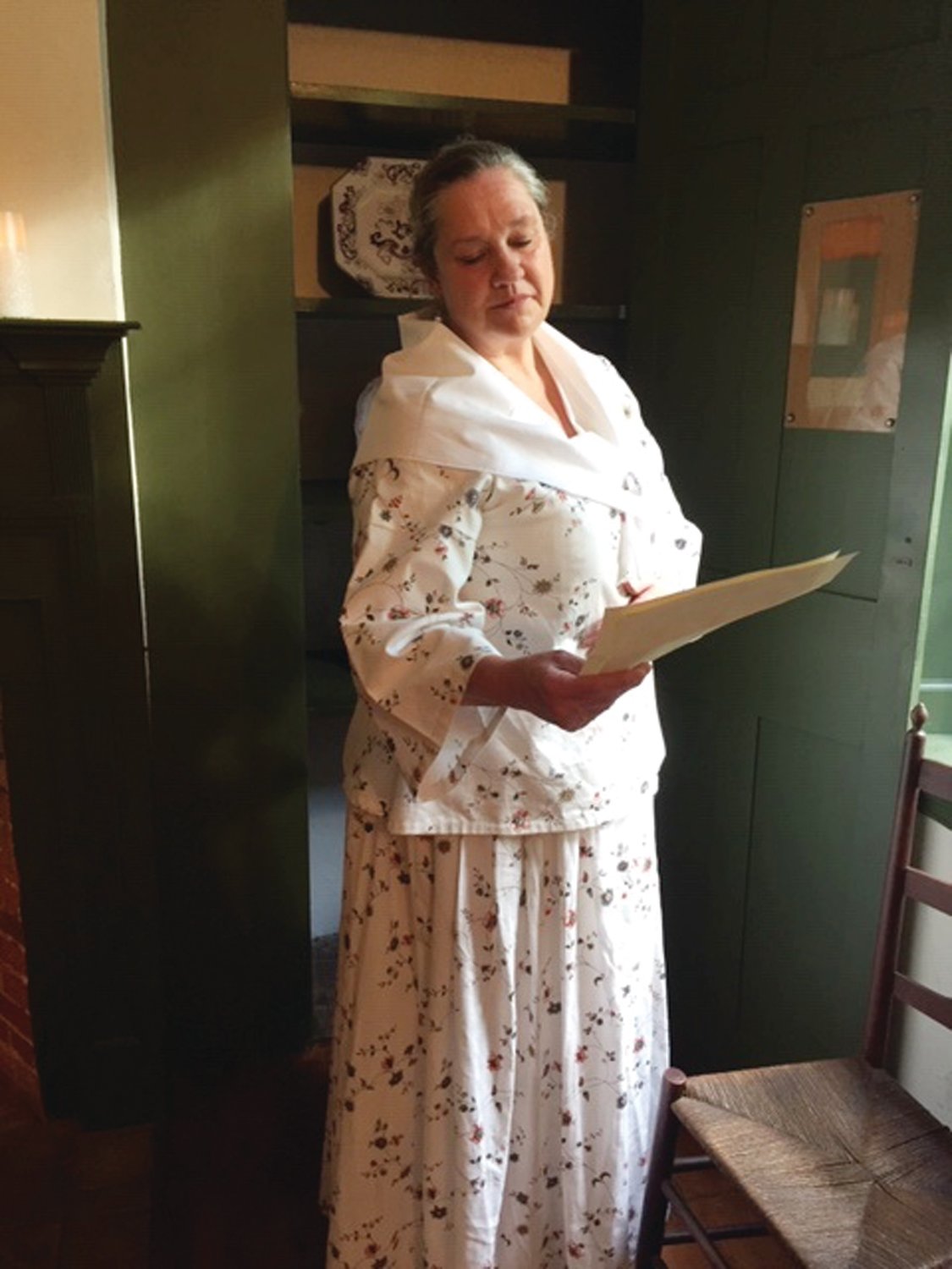 Mary Kennedy Erwin, played by Sue Meacham, reads a last letter from her husband, Col. Arthur Erwin, who has been away too long at the northern frontier in 1791.