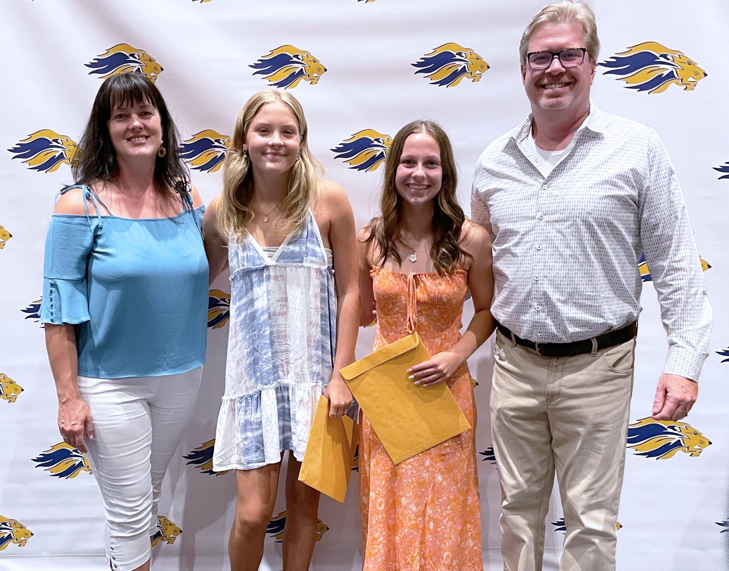 Judeth and James Finn with New Hope-Solebury seniors Kayci Lane and Ciara Maguire, the first recipients of the Charles W. McHenry Memorial Scholarship.