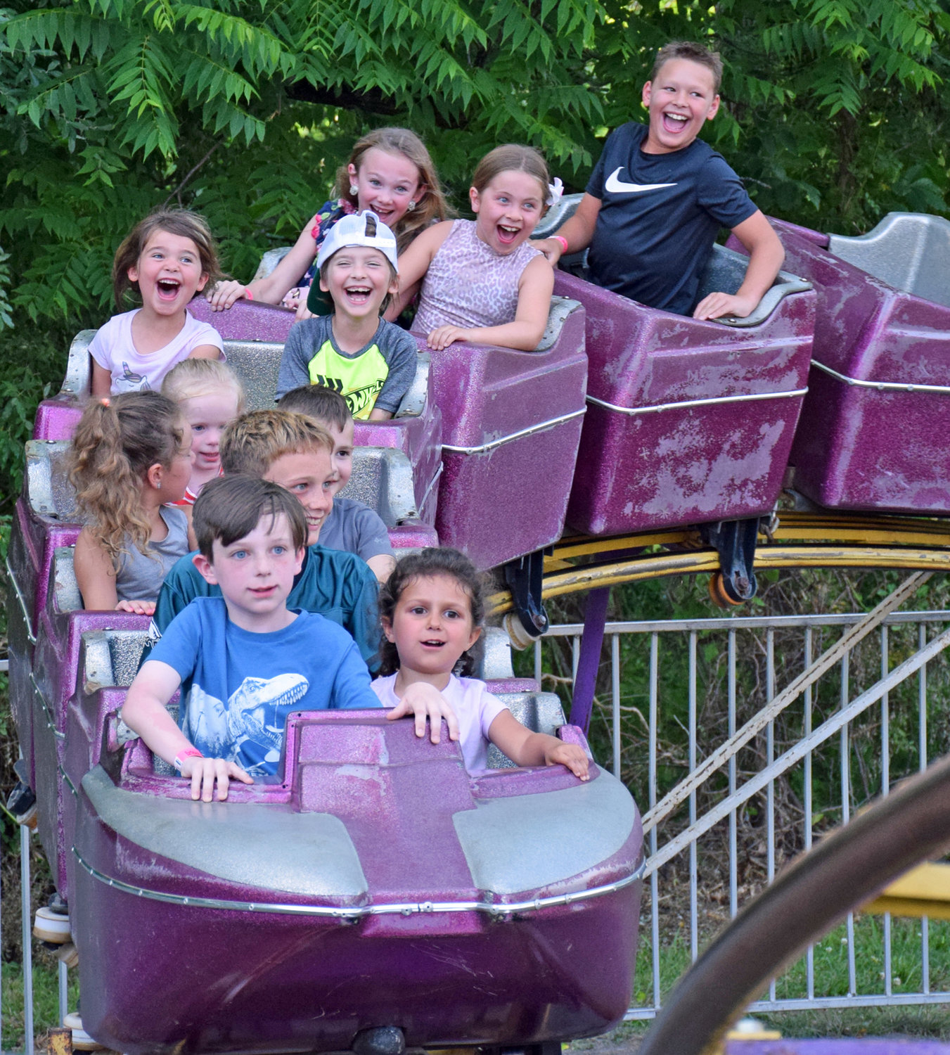 Children ride the roller coaster at the Perkasie Fire Company 
Carnival.