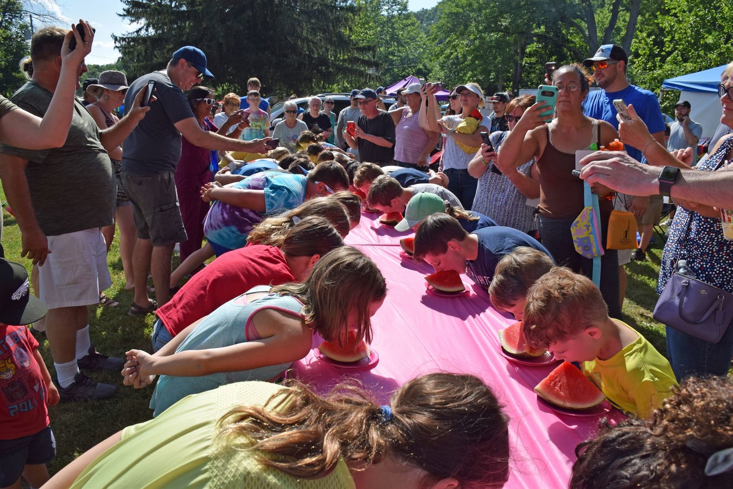 The Watermelon Eating Contest began with the 12 and under category.