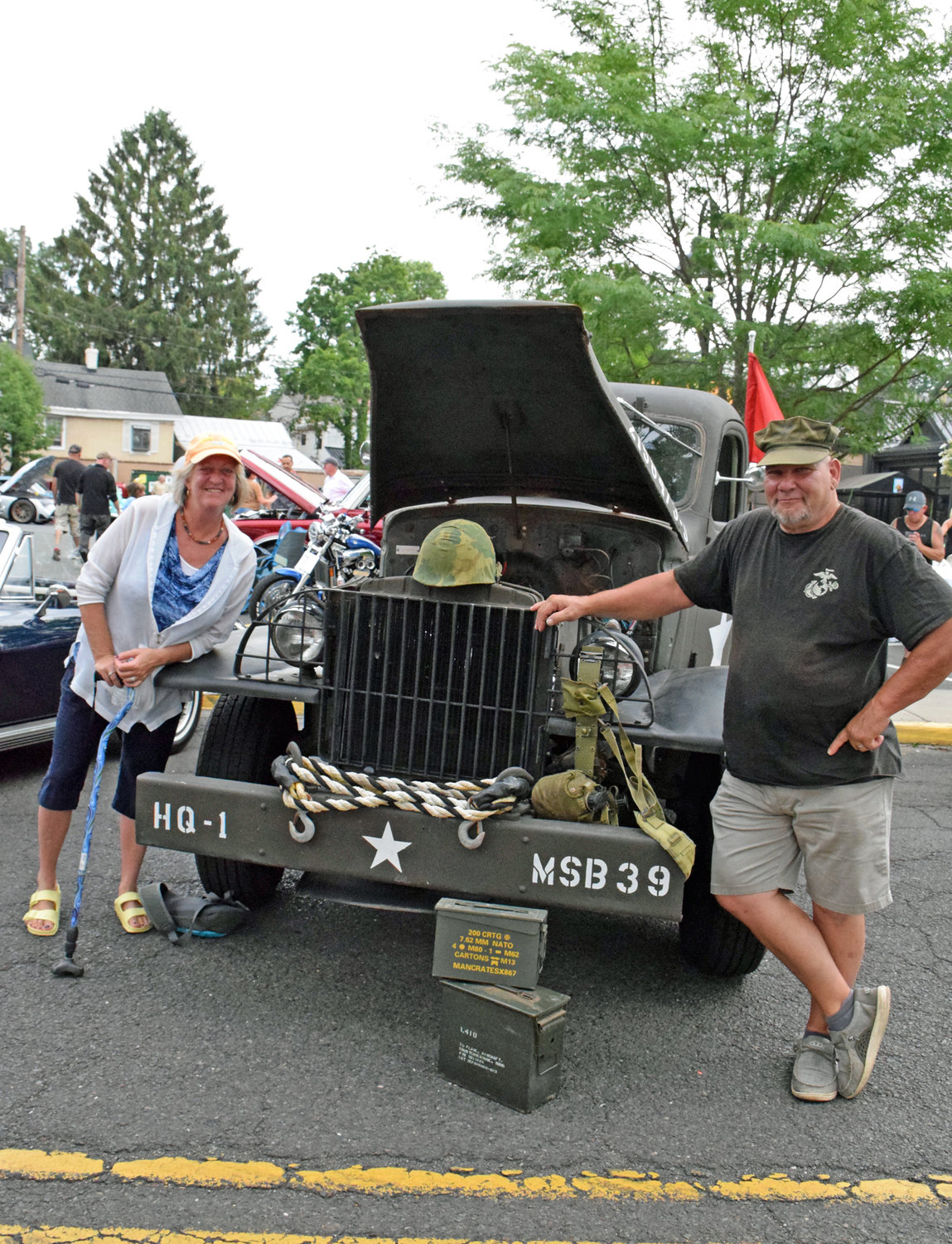 Amy Payton with Ed Ackermann, owner of the restored Army truck.