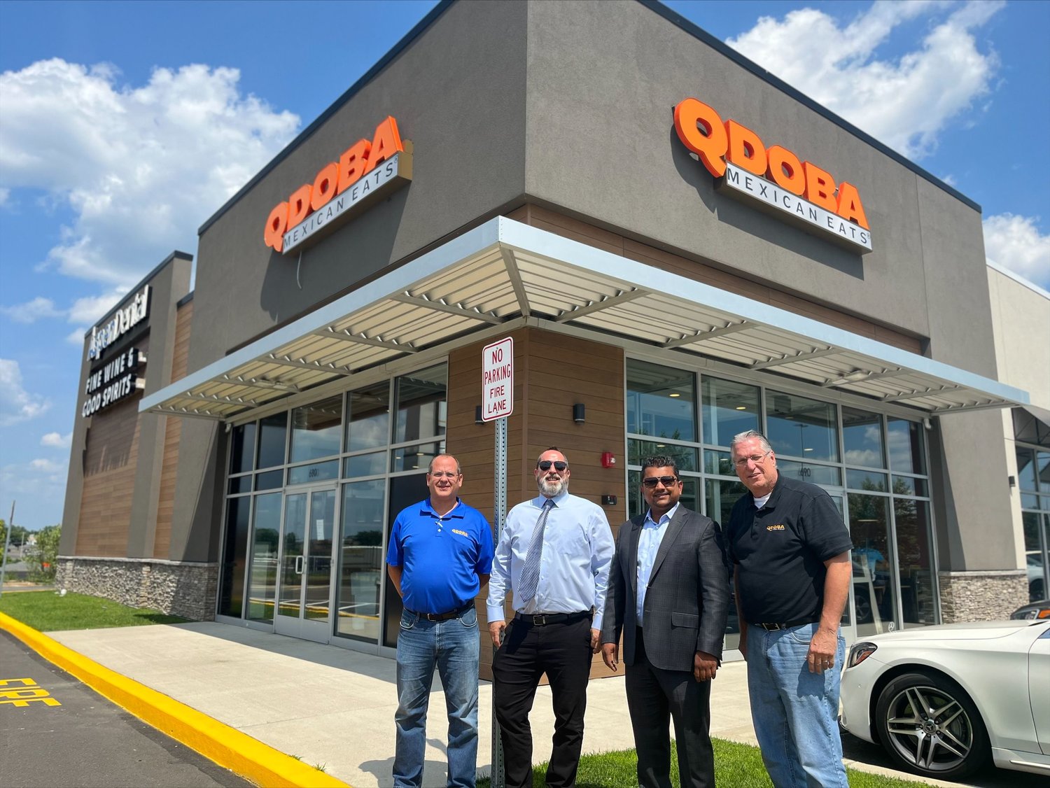 From left, TIG Corp. leaders Rick Sanseverino, Shane Lenahan, Jiger Patel, and Kevin McWilliams cut the ribbon on their latest QDOBA Mexican Eats Restaurant Monday July 25, in Bucks County.