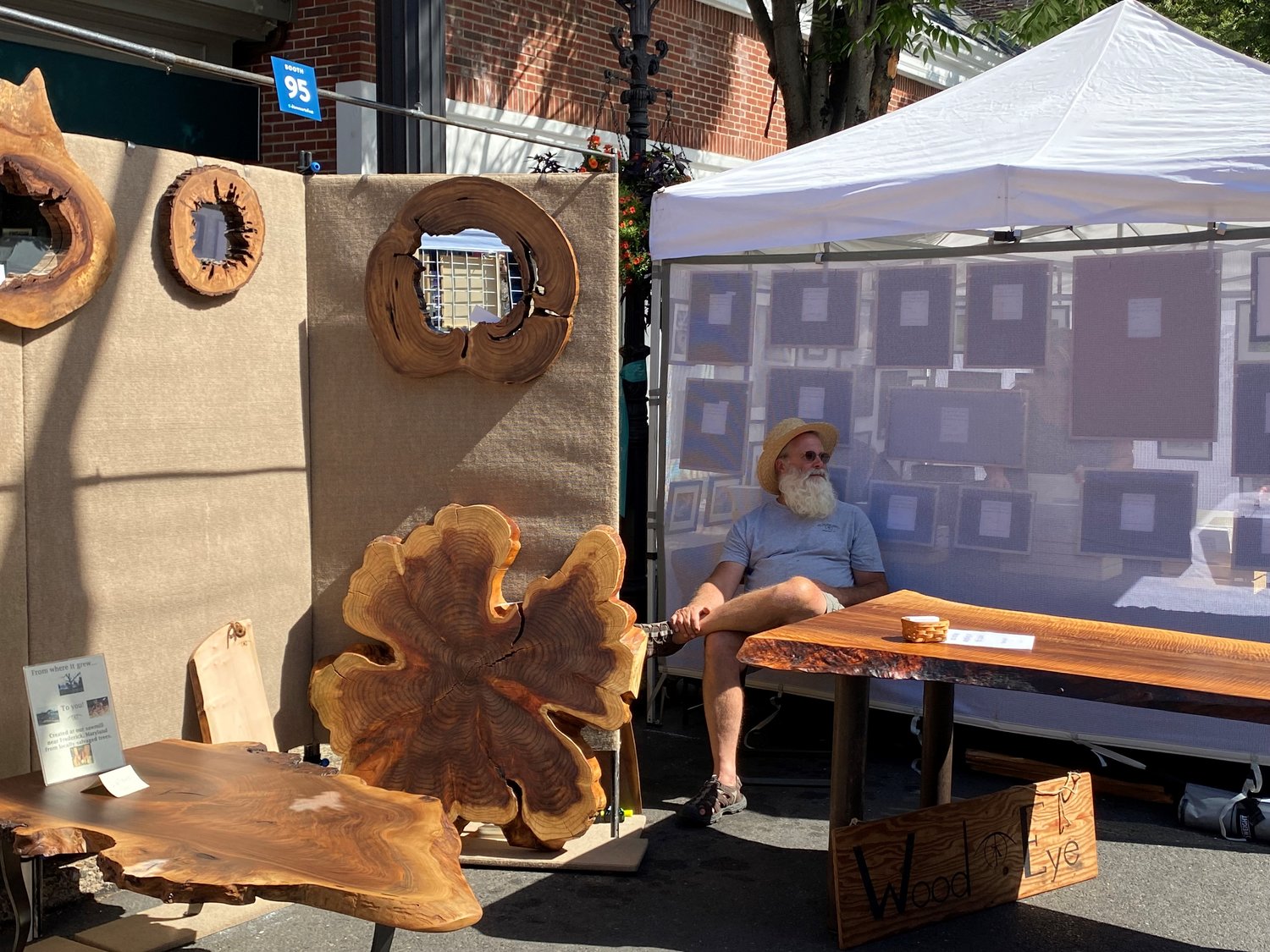 A woodworker takes a rest during the Doylestown Arts Festival last weekend.