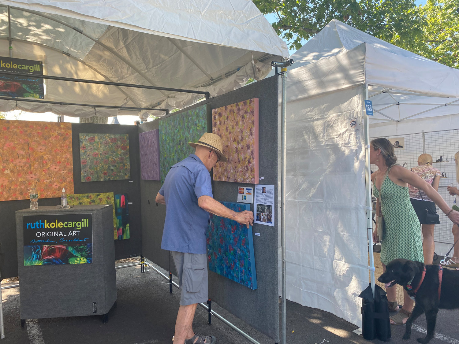 A painter adjusts his work at the 31st Doylestown Arts Festival on Sept. 10 in the heart of the borough.