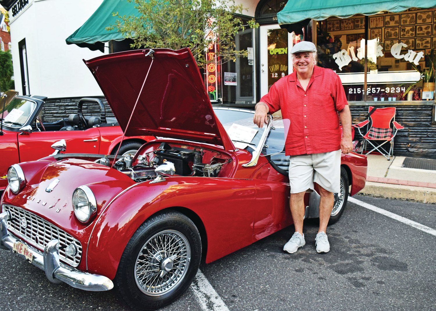 Jim Phillips and his 1962 Triumph on Walnut Street, part of the “The British are Coming” show.