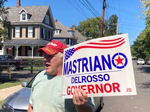 Solebury Township Republican Committeeman Keith Wolff holds up a Mastriano for governor sign during a press conference in Newtown Borough on Thursday, Sept. 15 held to criticize Doug Mastriano’s education plan.