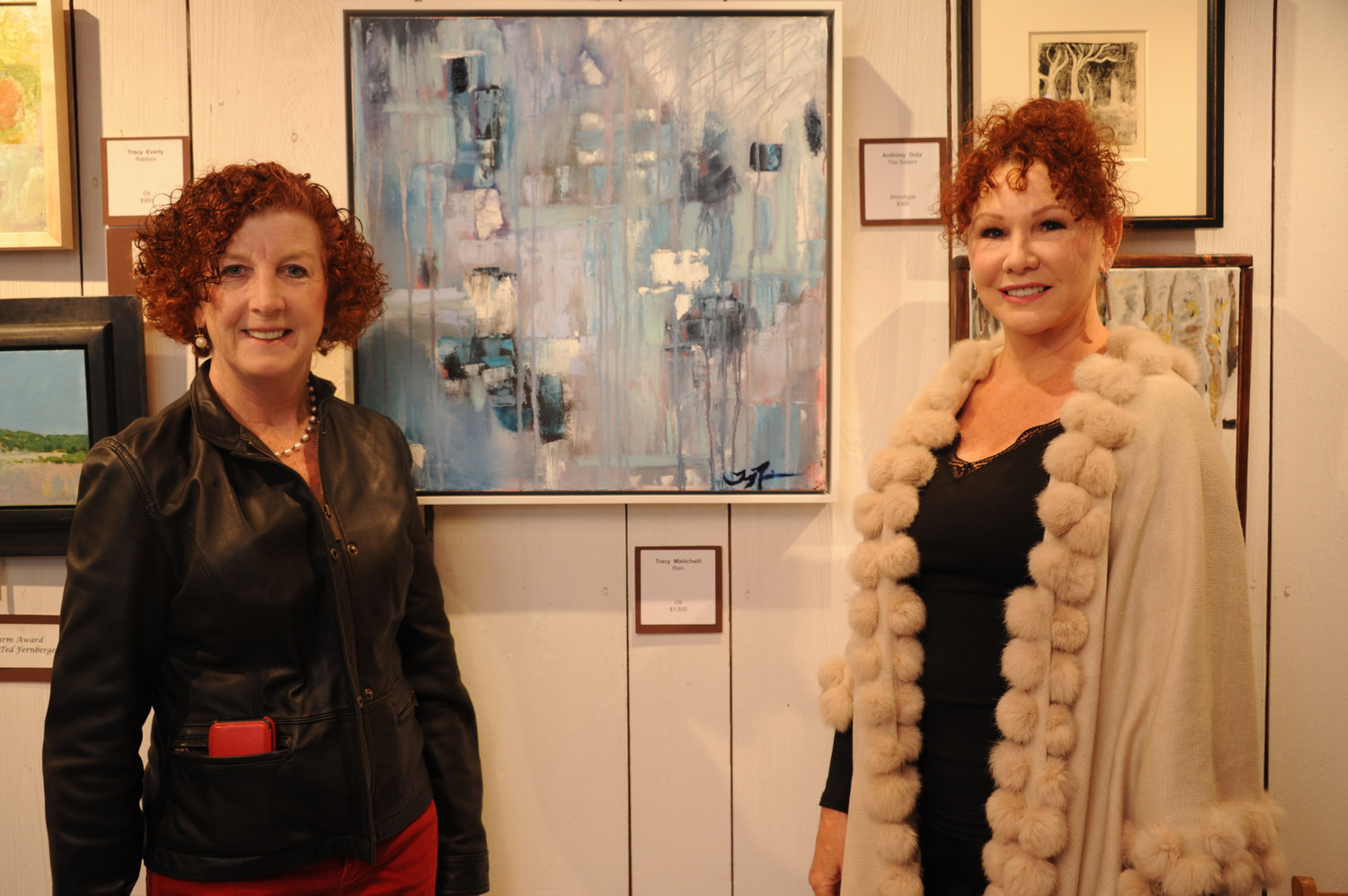 Maureen Feury and artist Tracy Mistichelli, whose painting “Rain” is pictured in the center.