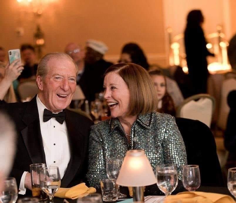 Tom McNutt with his wife, Helen, at a festive event.