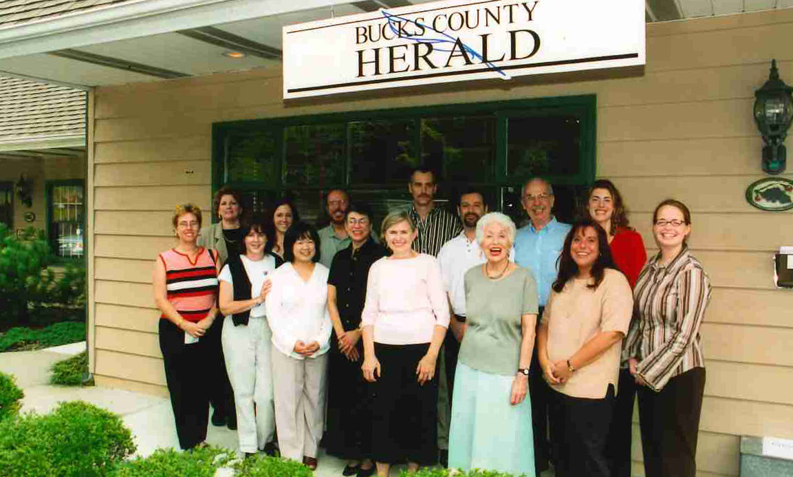 The Bucks County Herald staff outside the first Herald office in Lahaska at the newspaper’s first anniversary.