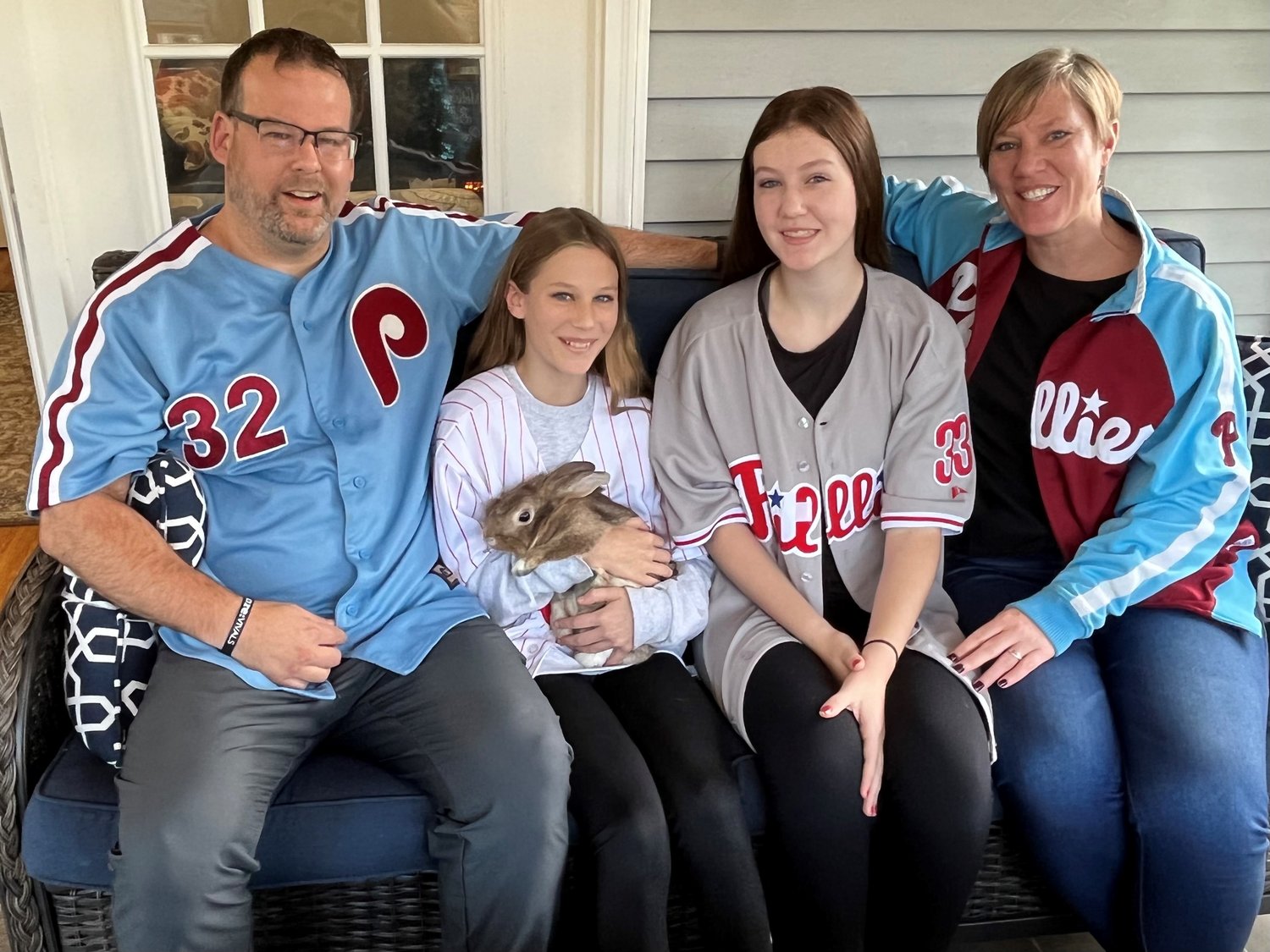 The Peloquin family, from left, Jeremy, Emma, Ryley and Kelley, with Harper the bunny, adopted from the Bucks County SPCA. Harper joined the family after Emma and her father made a bet during Game 5 of the National League Championship Series that she could adopt a bunny if the Philadelphia Phillies’ Bryce Harper hit a home run in his next at bat, which he did.