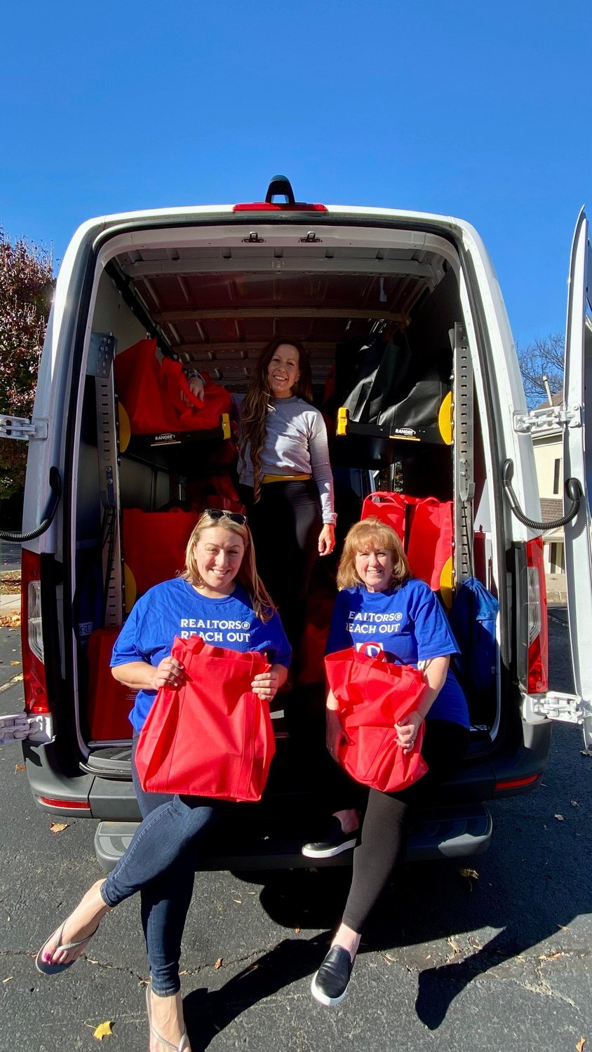 Reach Out Committee co-Chairs Jessica Finnell and Susan Langenstein, along with The Bucks County Housing Group’s Lindsay Troyer,food pantry manager.