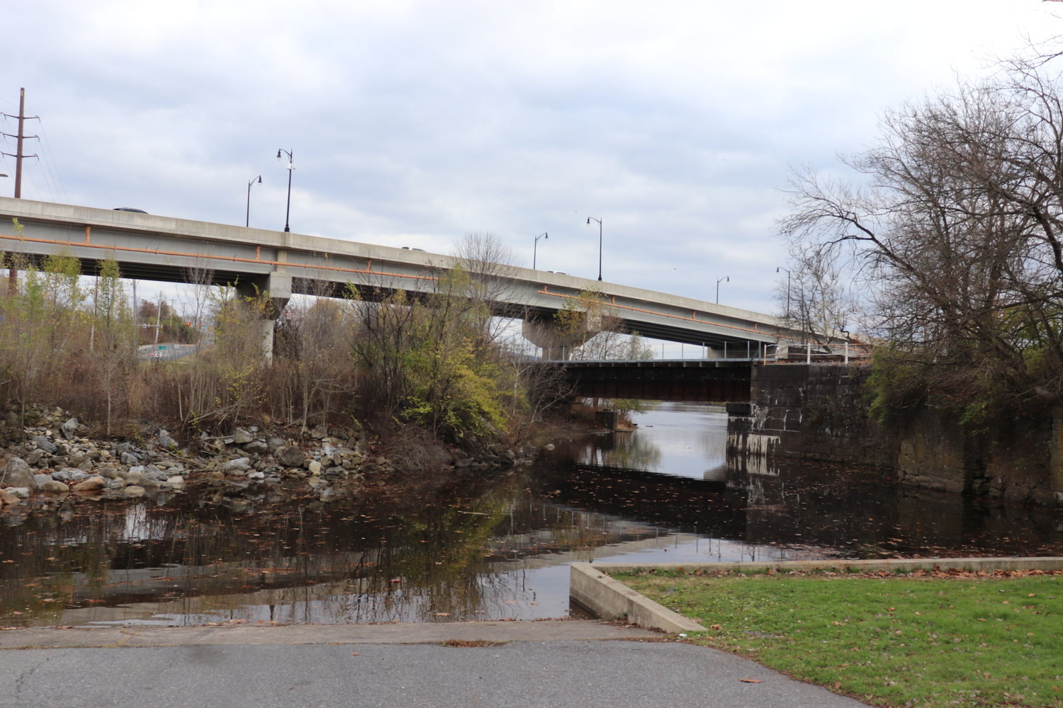 The DLNHC funding location view at Kimmett’s Lock Trailhead,
where the trail will travel underneath the bridge in the background, bypassing the trestle in the image.