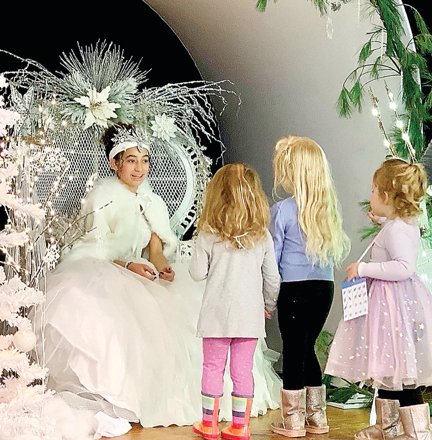 The Snow Queen meets with children.