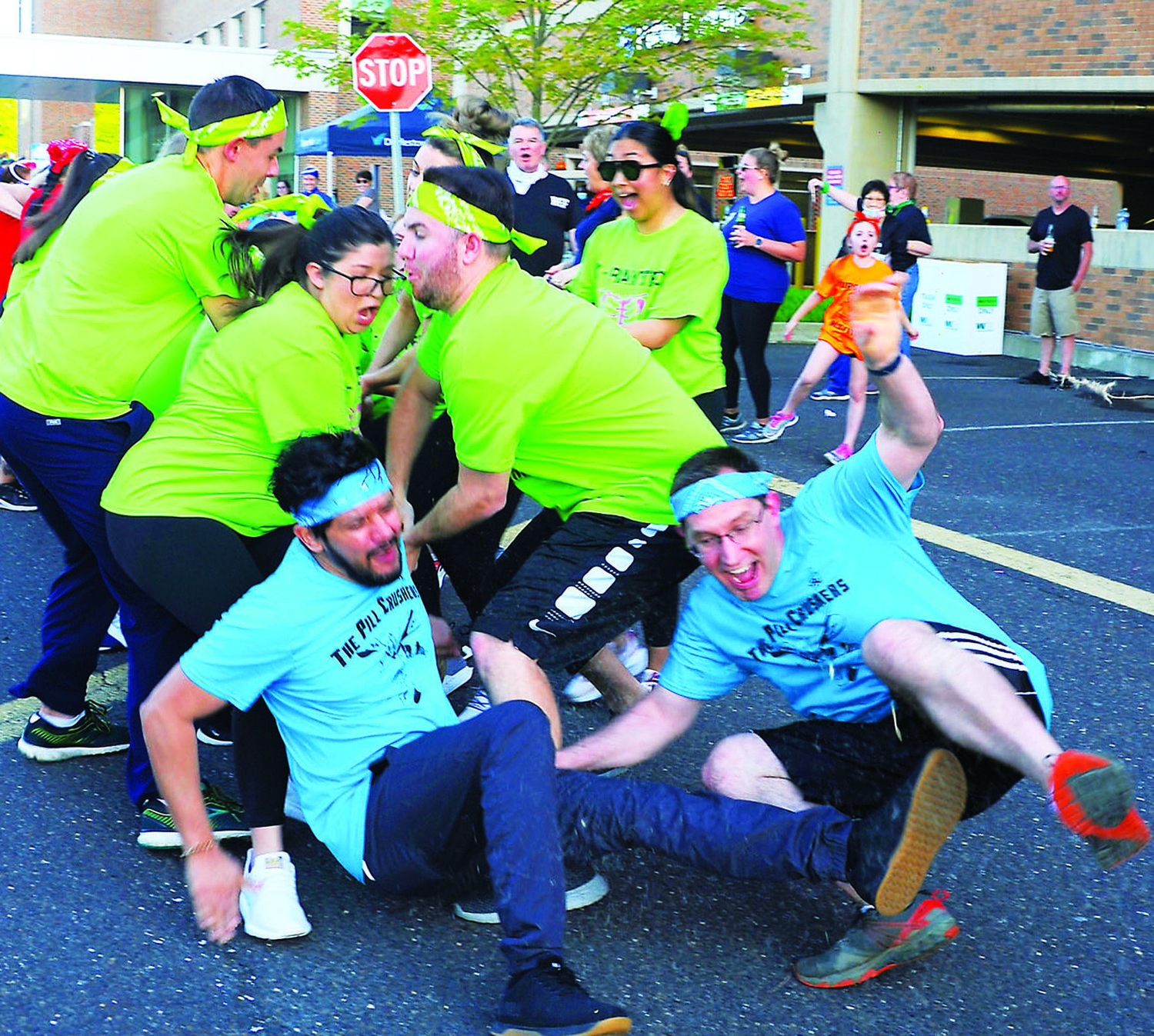 Teams of doctors, nurses and Doylestown Health associates participate in Survivor Day, an event that takes its theme from the television show. Shown is the final event, tug-of-war.