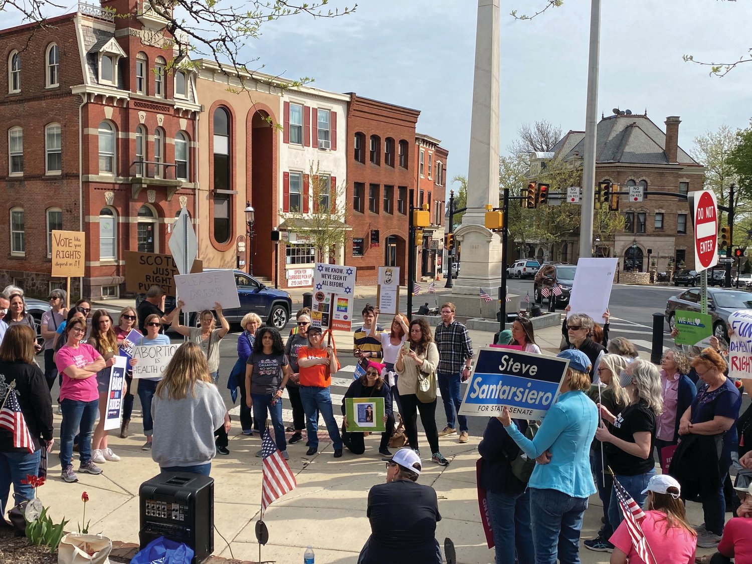 More than 100 people gather outside the former Bucks County Courthouse in Doylestown to call for reproductive rights in the wake of a leaked Supreme Court document sating Roe v. Wade should be overturned.
