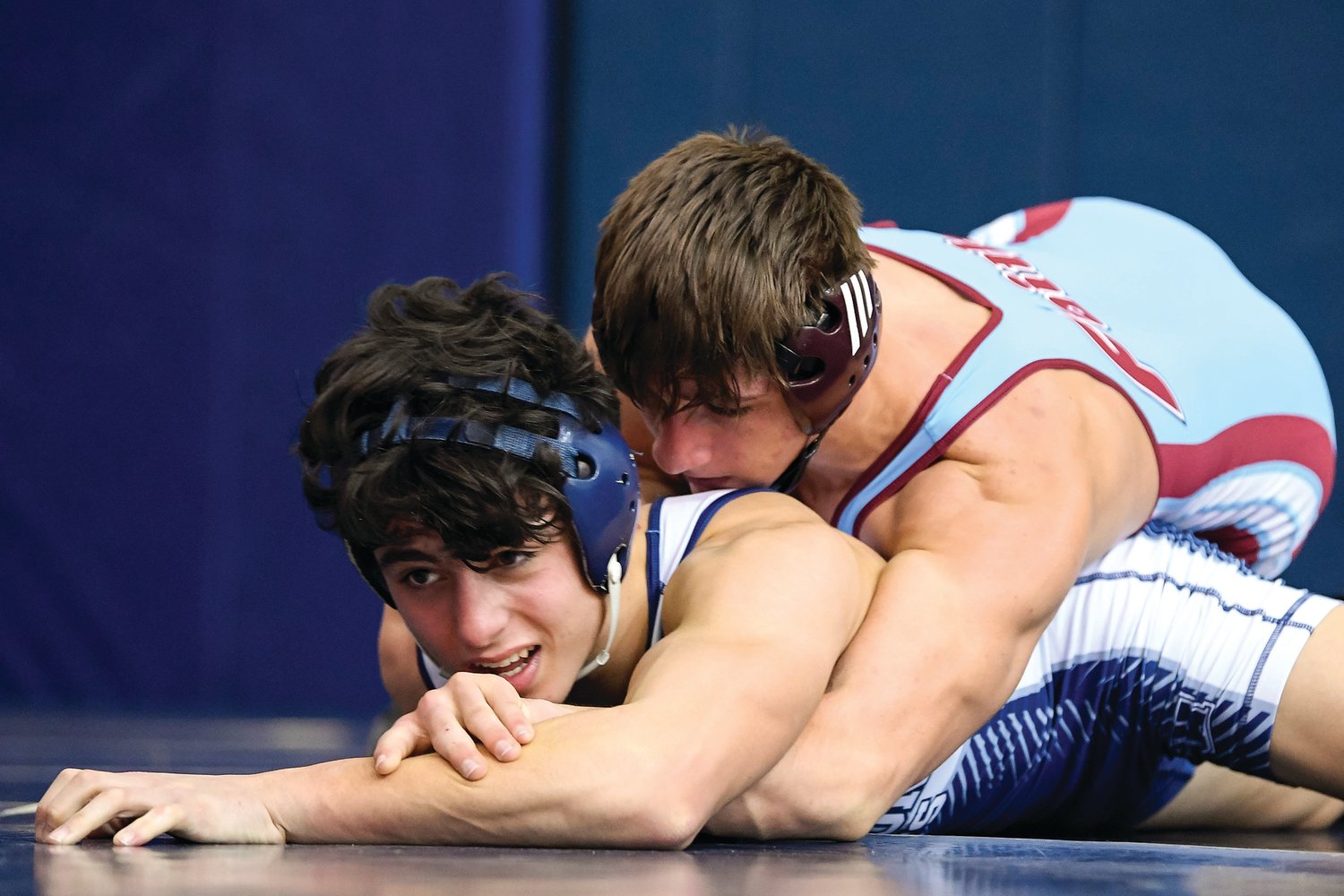 Faith Christian Academy’s Cody Wagner (on top) during his 160-pound match against Abington Heights’ Colin Price. Wagner would win this match by a 8-0 decision.