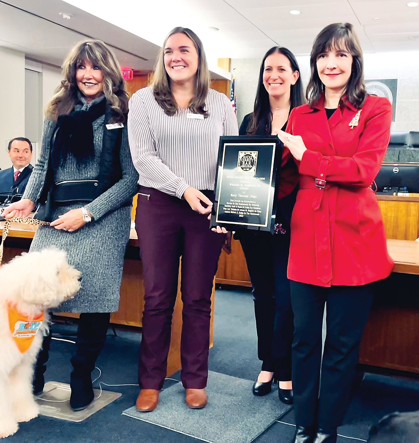 Roxy Therapy Dogs volunteer Daire Goettler and her therapy dog Teagan; Melissa D’Amato, director, Roxy Therapy Dogs Courthouse Program; Grace Deon, partner, Eastburn & Gray; and Julie Goldstein, Bucks County Bar Association outgoing president.