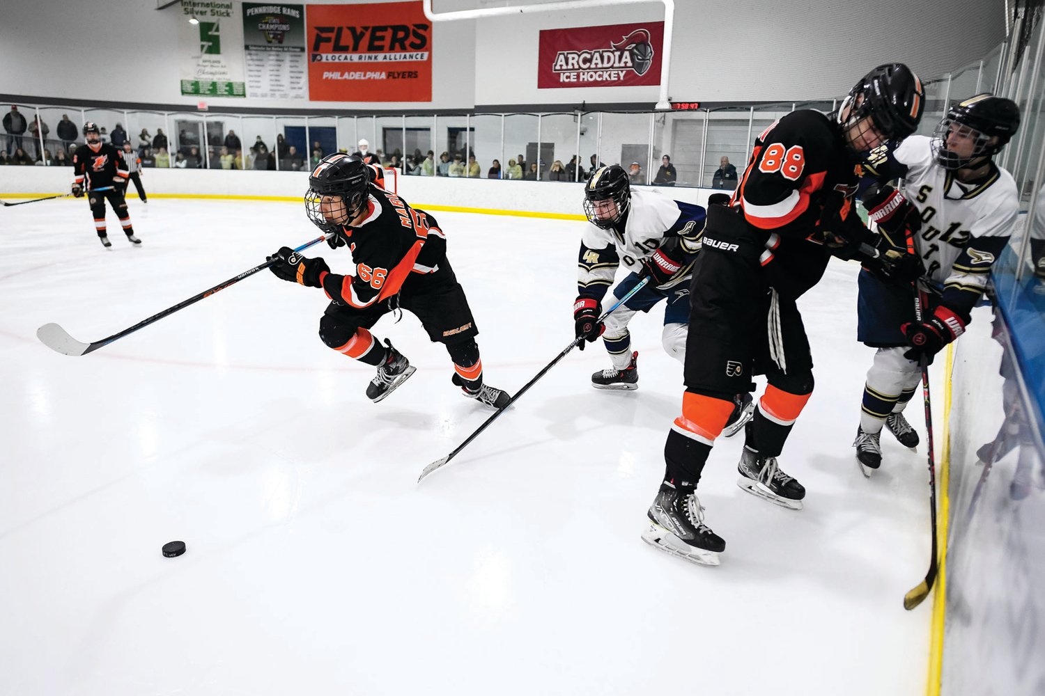 Pennsbury’s Justin Marlin clears the zone after a battle in the boards.