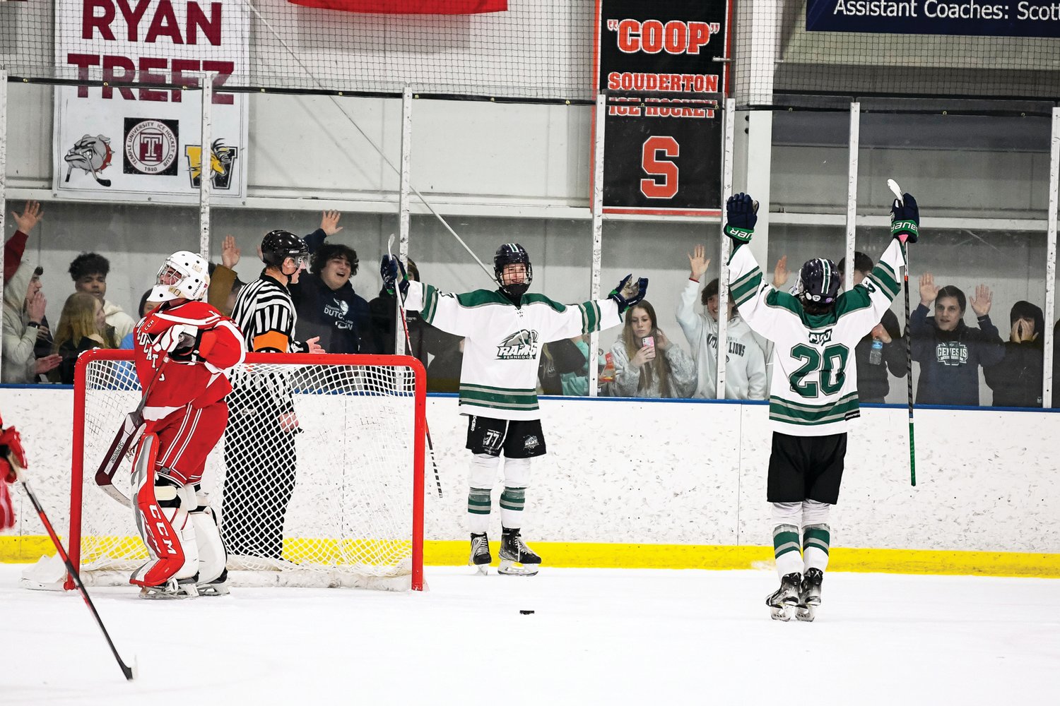 Pennridge’s Shane Dachowski, center, celebrates after scoring the second of three goals, putting Pennridge up 5-0 in the second period.