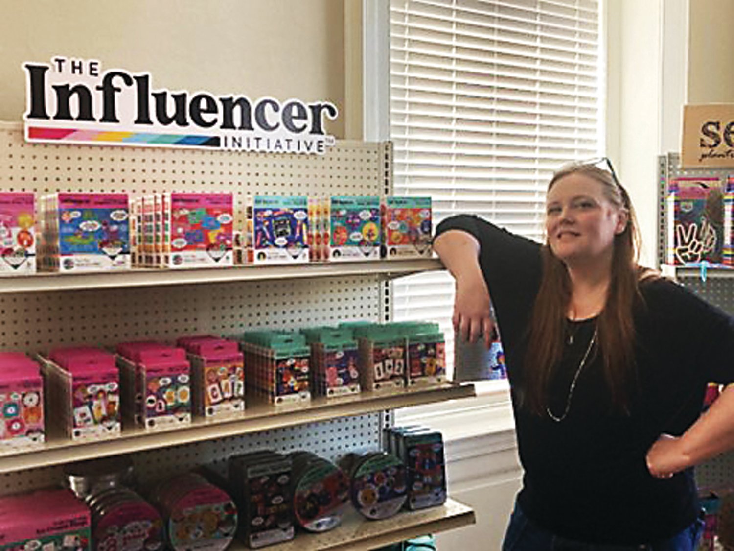 Amy Houser, WeVeel Toys’ creative director for its new The Influencer Initiative line, with some of the toys offered in the line.