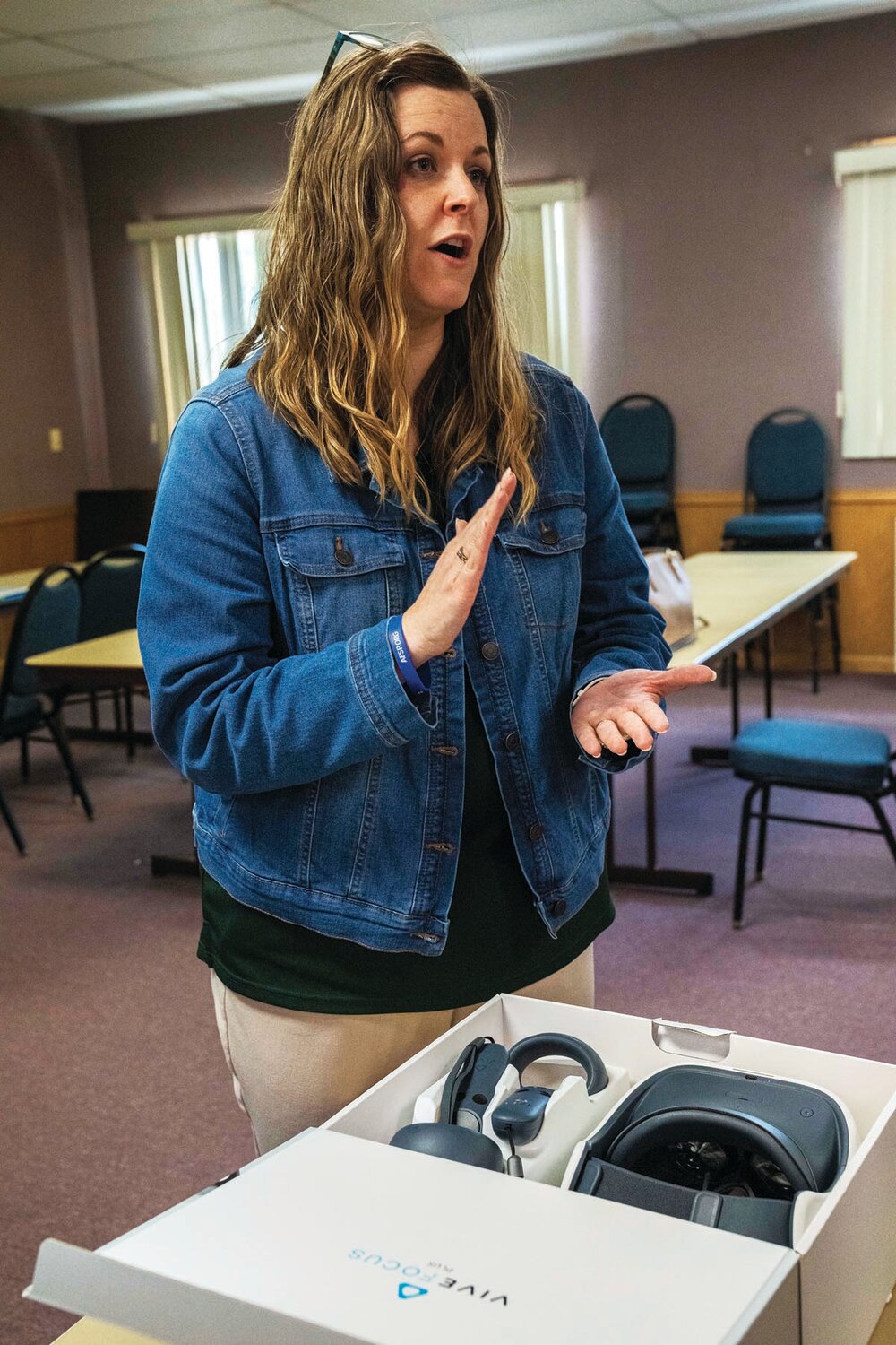 Lenape Valley Foundation’s Nicole Wolf, co-chair of the Bucks County Crisis Intervention Team Task Force, instructs law enforcement officials from across the county who gathered May 18 to test out virtual reality headsets as part of their Crisis Intervention Team certification training.