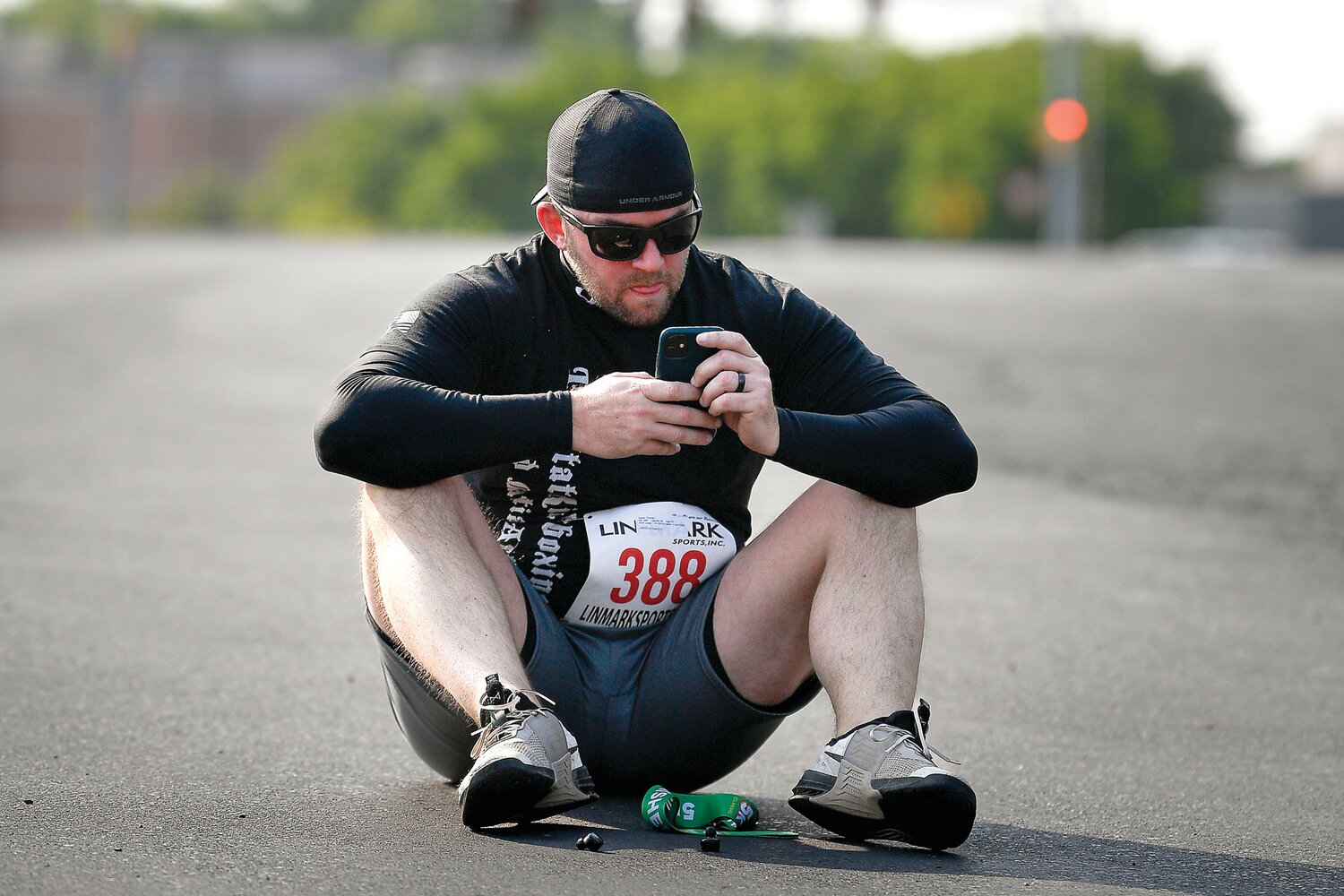 Tom Karas of Warminster checks the real-time results after finishing the 5K in 27:40.
