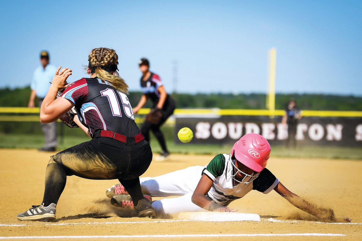 Dock Mennonite’s Ceara Barnes gets back safely during a pickoff attempt.