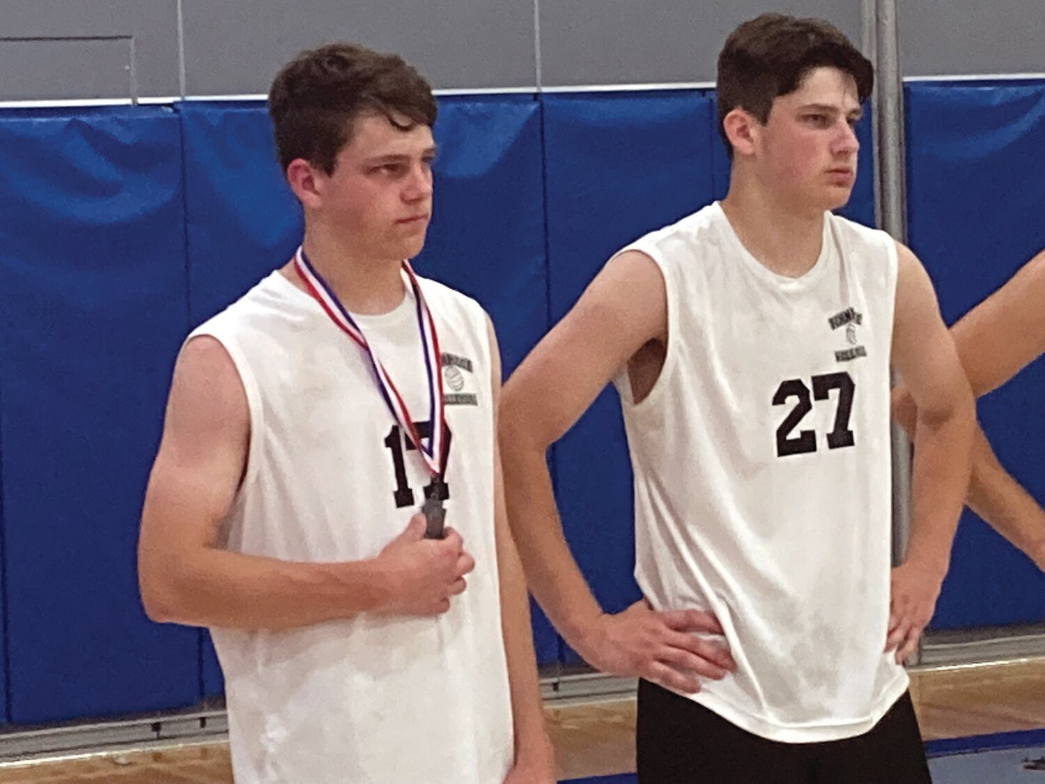 Disappointed Pennridge volleyball players Evan Jalosinski, left, with second-place medal, and Logan Jalosinski after the District One championship match loss to Upper Dublin.