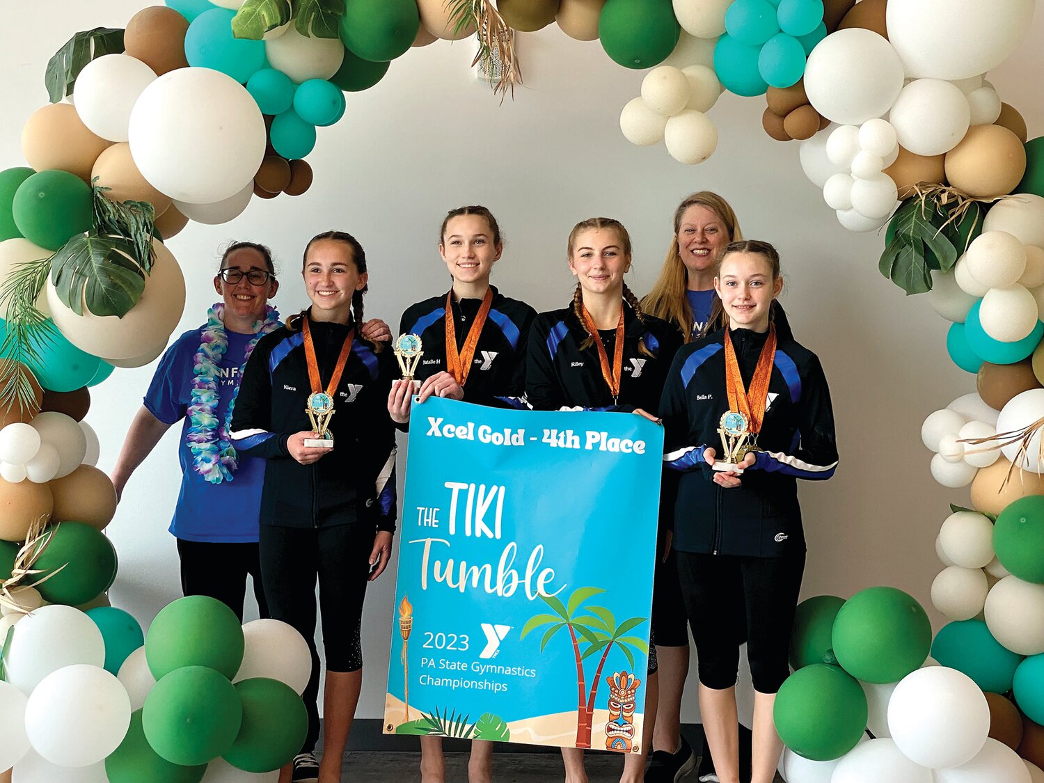 The Xcel Gold fourth-place team: From left: Kiera McComsey, Natalie Higgins, Riley Moyer and Bella Price; back row, coaches Jade Wilhelm and Janine Brown. Missing from photo: Rachel Snedigar, Alexa Zwart and Dahlia Brose.