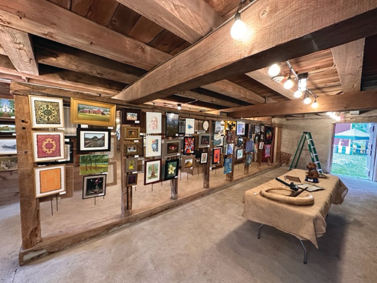 The upper and lower levels of the Tinicum Arts Festival Art Barn were filled with creative works  displayed on hanging structures assembled by Damon Aherne and John Cole.