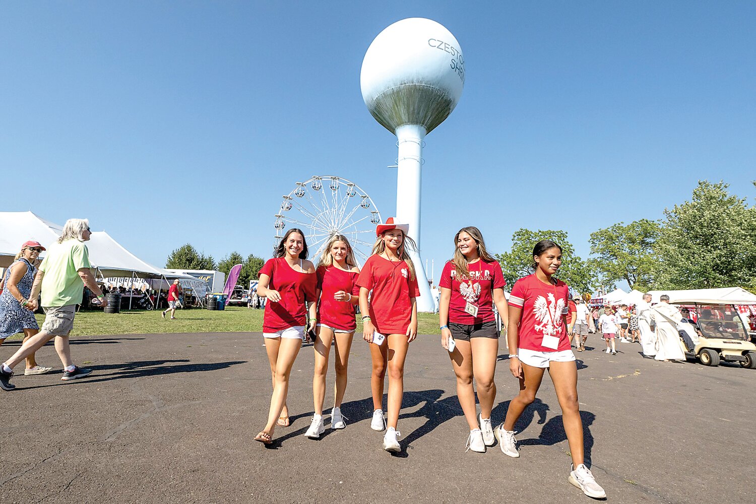 A group of teens wander through the fair grounds during the 57th annual Polish American Family Festival & Country Fair.