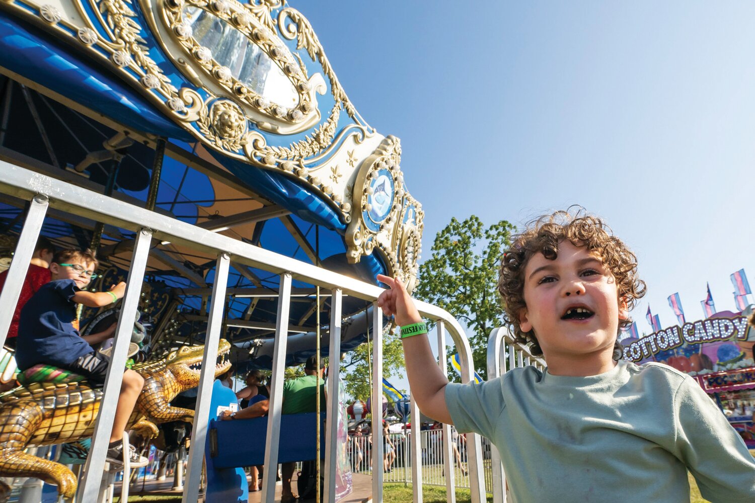 Elliot Strenger, of Doylestown, waits for a ride on the carousel during the 57th Annual Polish American Family Festival & Country Fair 2023 Sunday at Our Lady of Czestochowa.