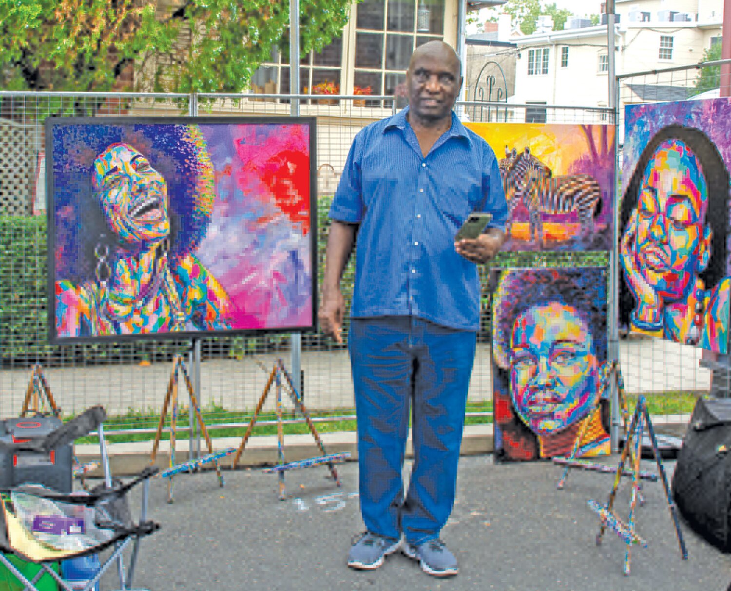 Charles Kezengwa displays his work at the Kezengwa African Art booth.
