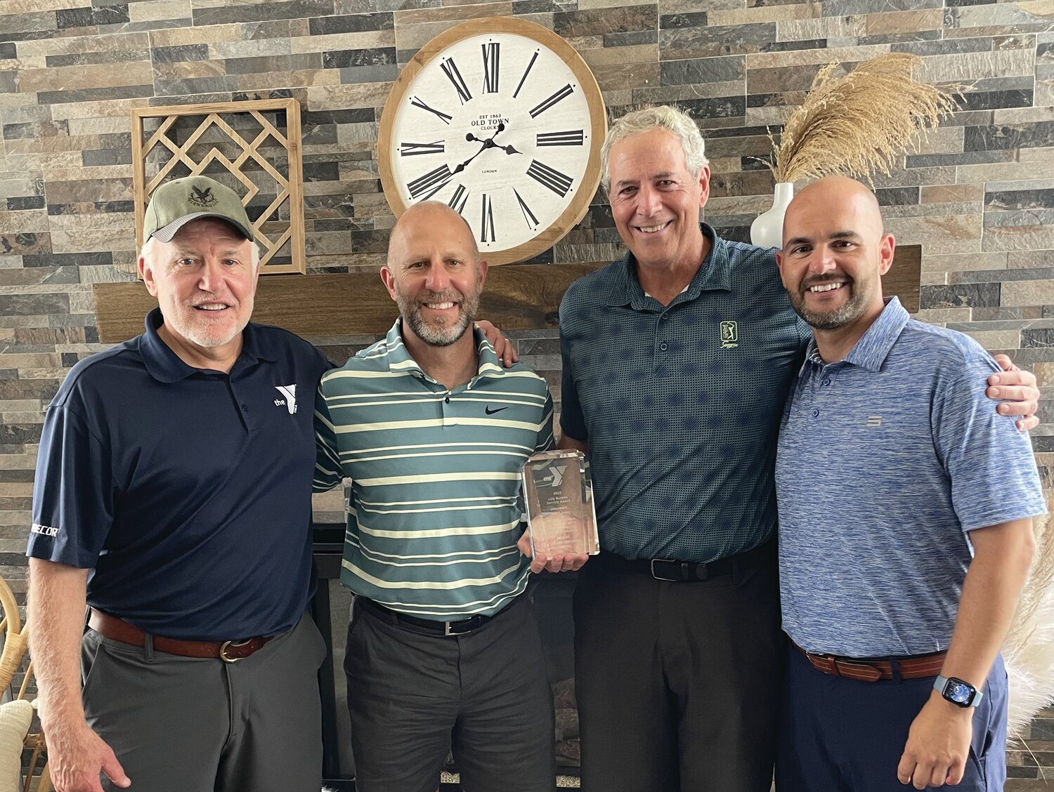 From left are: Chief Volunteer Officer of YMCA of Bucks and Hunterdon Counties Allen Childs with President/CEO Zane Moore, Burpee Award recipient Rich Lovely and Association Vice CVO Nick Yelicanin.